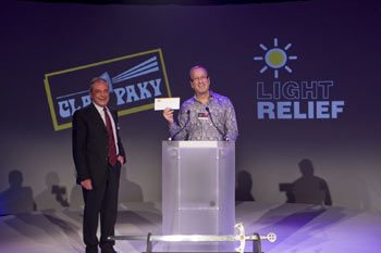 Clay Paky's President Presents Light Relief Cheque