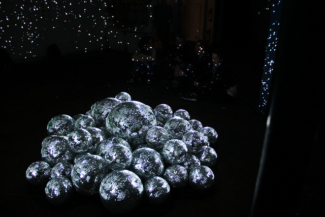 Shiny Disco Balls Via 50 Disco Balls and 3 Light Projectors