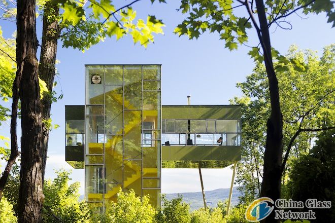An Amazing Glass House That Peeks Over The Forest