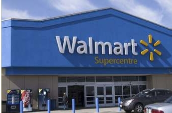Wal-Mart Raises Outlook, Shares Slide on Sales