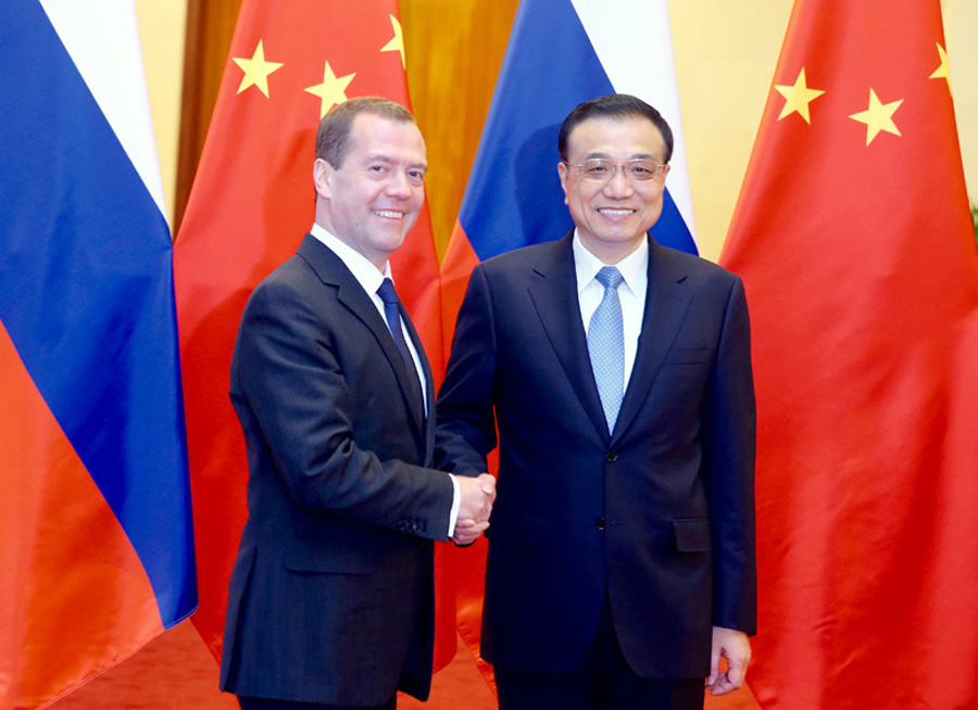 China, Russia Sign Over 30 Deals During Medvedev Visit